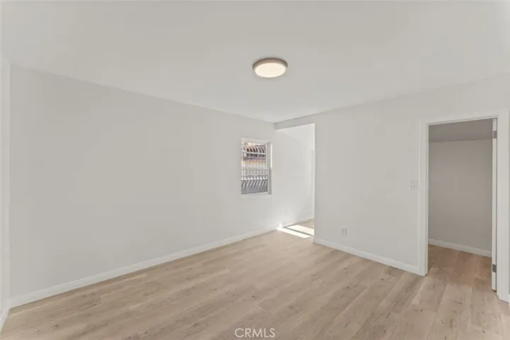 Primary bedroom w/ walk-in closet