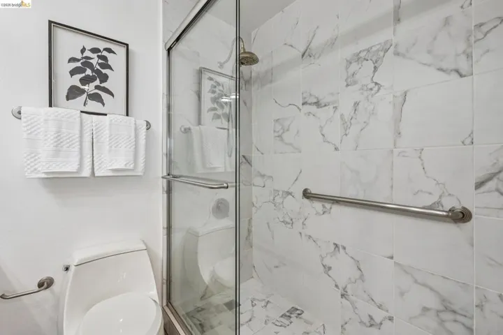 Full bathroom with a shower stall