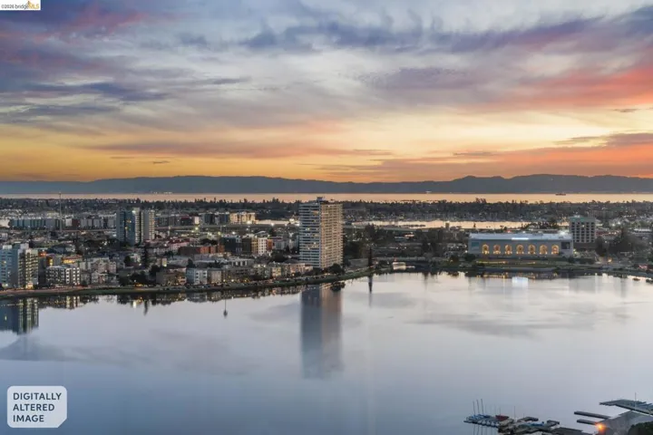 Water view with nearby urban area and a mountain backdrop