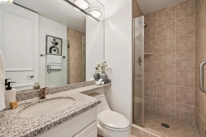Bathroom with vanity and a shower stall