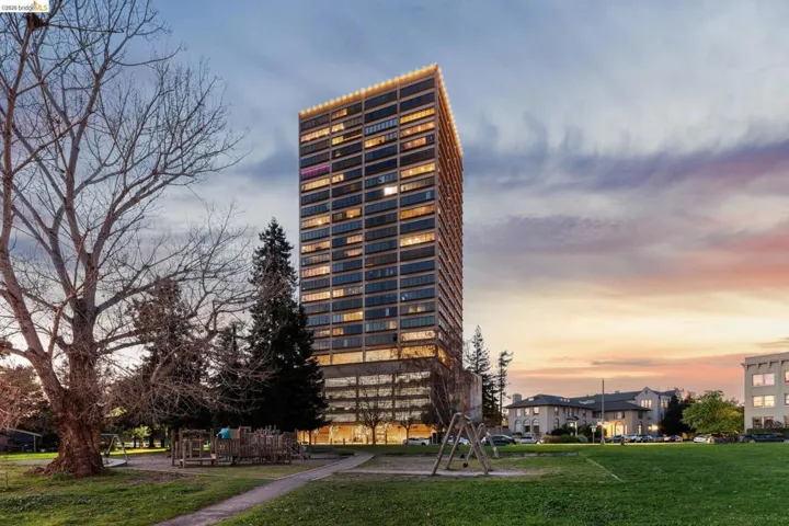 View of property at dusk