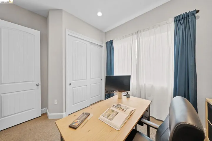 Office space featuring light carpet and recessed lighting