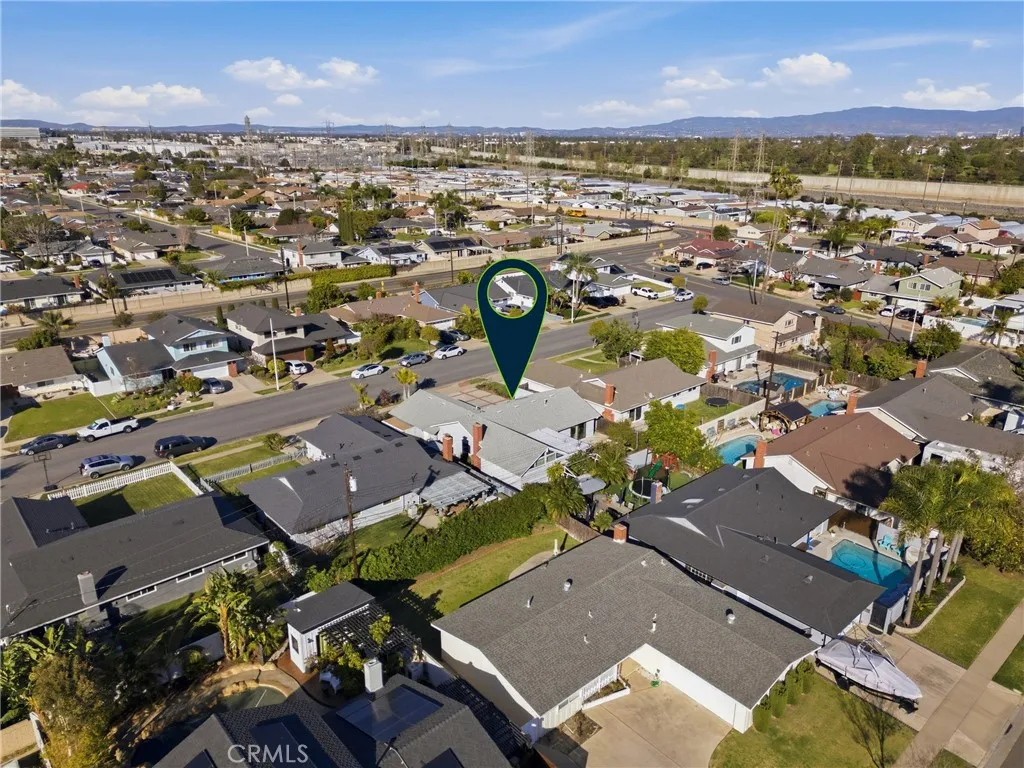 Rear aerial showing the low-maintenance backyard and overall lot layout.