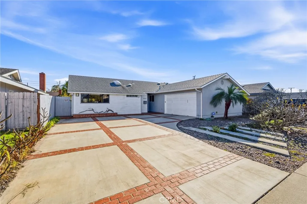 Wide driveway space for multiple vehicles and everyday convenience.