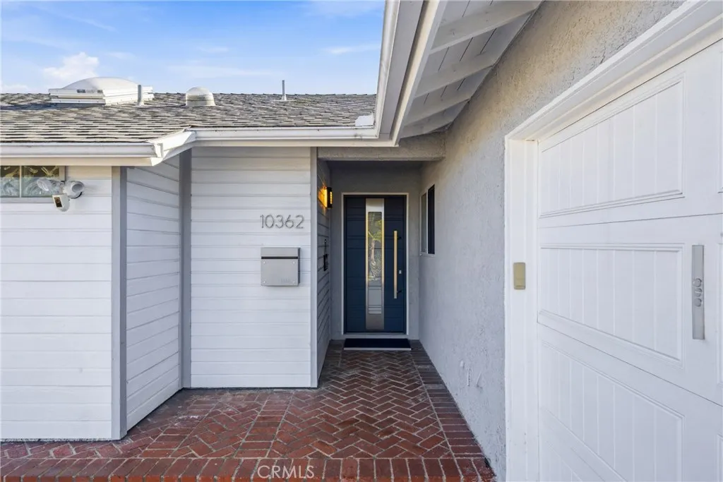 Entry walkway leading to an inviting modern front door.