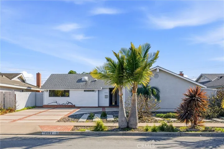 Strong curb appeal with low-maintenance landscaping and a wide extended driveway.