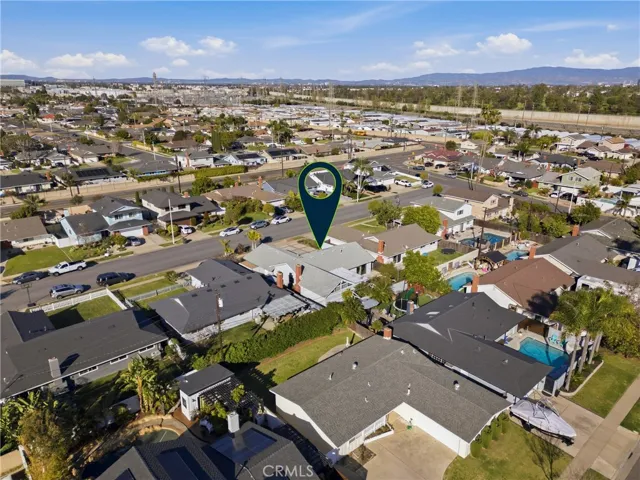 Rear aerial showing the low-maintenance backyard and overall lot layout.
