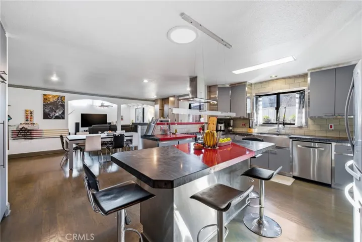 Quartz and granite countertops with plenty of prep, seating, and serving space.