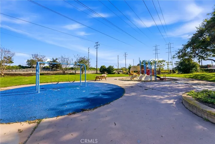Updated secondary room with ceiling fan and fresh baseboards.