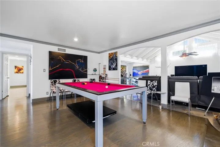 Dining and entertainment space, featuring a table that doubles as a pool table.
