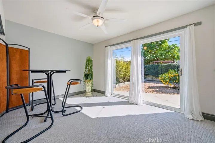 One secondary bedroom offers a sliding door to the backyard for extra light.