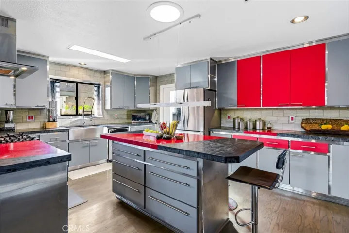 Built-in center island adds storage, prep space, and casual seating options.