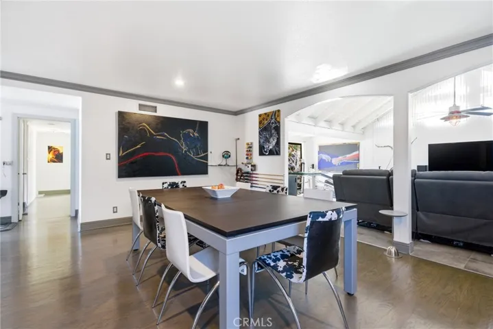 Dining area view showing the flow from kitchen to living room addition.