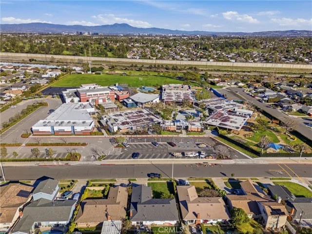 Rear aerial showing the low-maintenance backyard and overall lot layout.