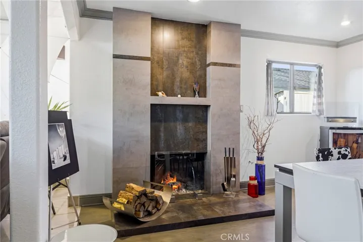 Sleek gas fireplace with contemporary tile adds a modern focal point.