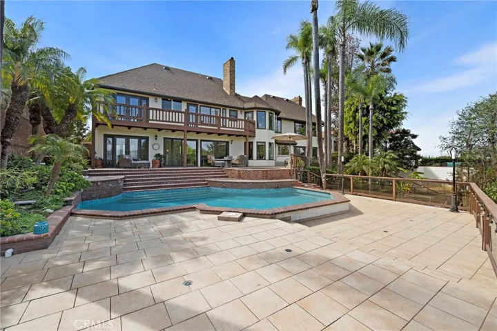 Lower view of pool with entertainment area
