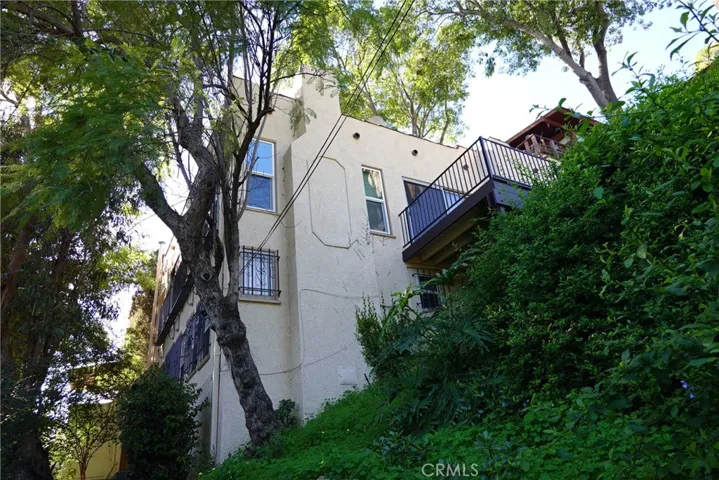 LOOKING UP AT BLDG FROM LOWER WALKWAY