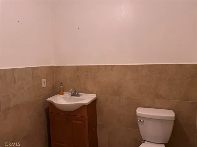 Bathroom including a walk-in shower located to the right.