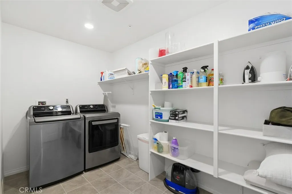 Separate Laundry Room upstairs with plenty of storage