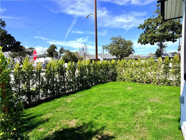 This larger side of the front yard can be used for additional play space for kiddos and pets.  A door can also be cut in the block wall separating this front portion from the side yard in the back making for a huge play space.  Perfect for a tree house, or swing set.