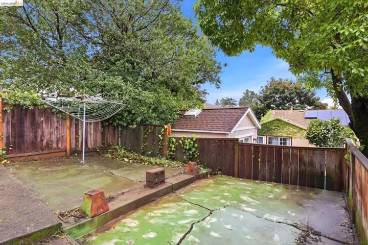 Fenced backyard with a patio