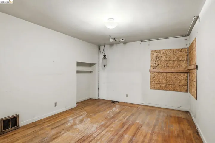 Bedroom with light wood finished floors and baseboards