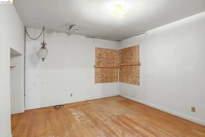 Bedroom featuring light wood finished floors and baseboards