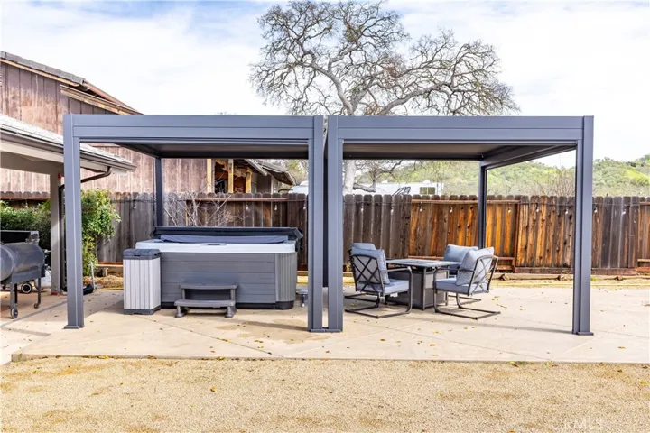 Spa and seating under the patio