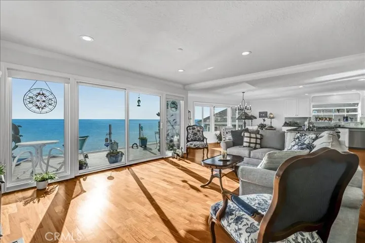 Open concept living room with coastal view