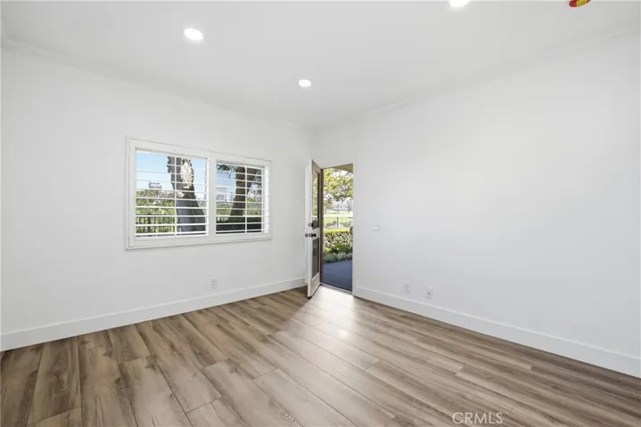 Secondary bedroom with access door to patio