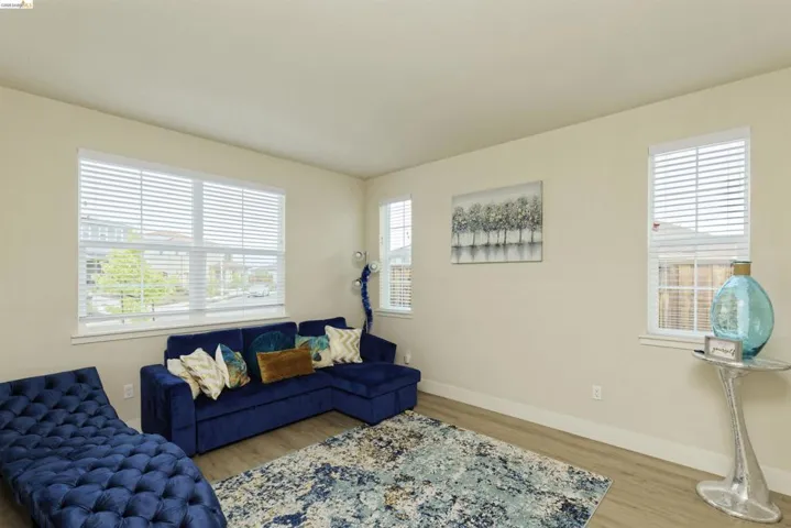 Living area featuring wood finished floors and baseboards