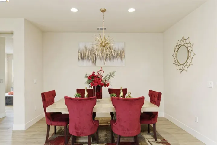 Dining space featuring recessed lighting, light wood-style flooring, and a chandelier