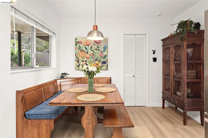 Dining area with wood finished floors and breakfast area