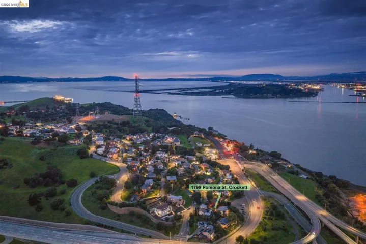 Aerial view at dusk of a water and mountain view