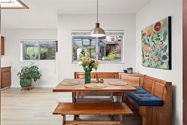 Dining area with breakfast area, light wood-style flooring, and plenty of natural light