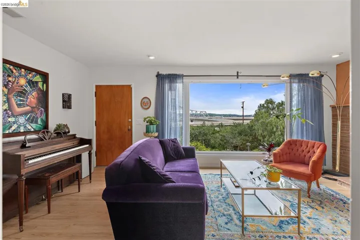 Living area featuring light wood-type flooring and recessed lighting
