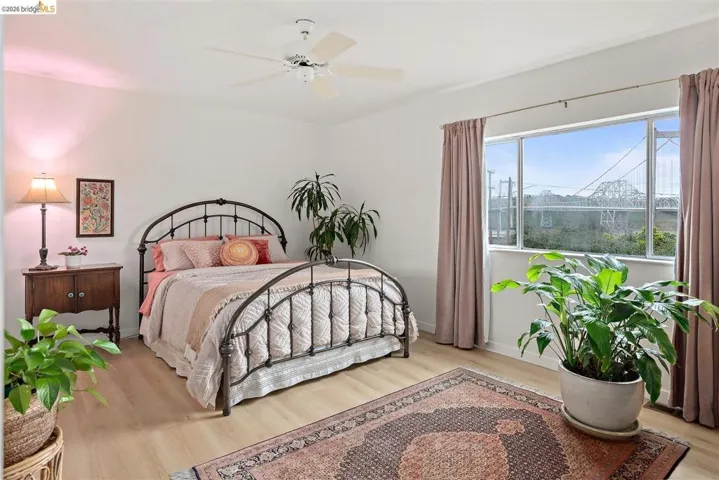 Bedroom featuring light wood-style floors and ceiling fan