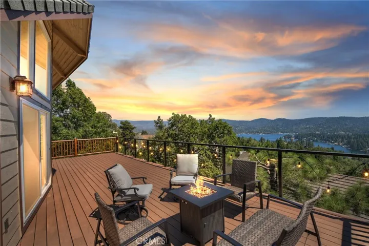 Enjoy patio seating and firepit while soaking in the lake view. Digitally altered.