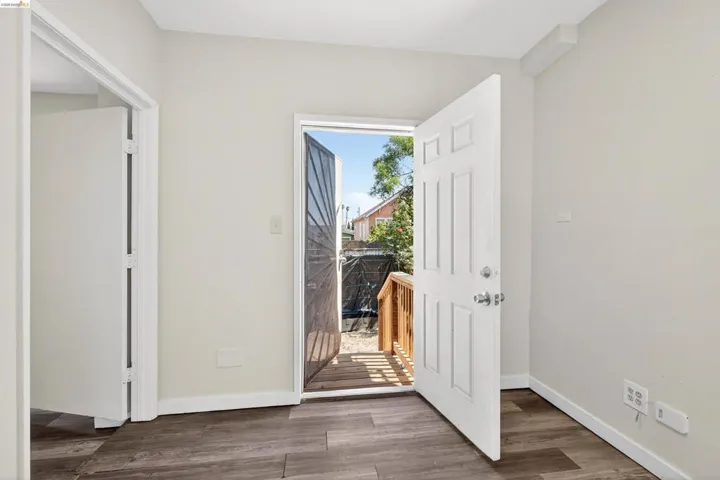 Wood-finish flooring throughout, complemented by light neutral wall tones and white​​‌​​​​‌​​‌‌​​‌​​​‌‌​​​‌​​‌‌​​‌‌​​‌‌​​​​ baseboards