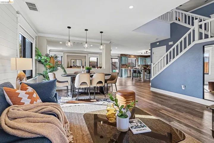 Living room featuring dark wood finished floors and recessed lighting