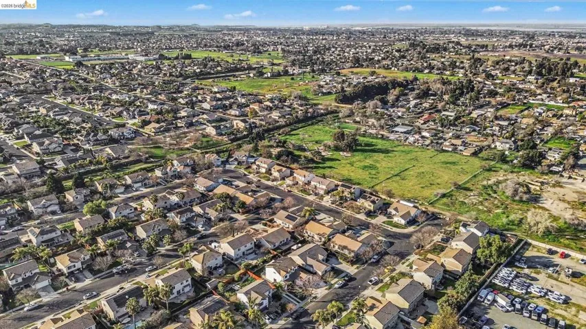 Aerial overview of property's location with nearby suburban area
