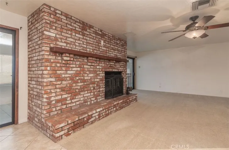 Cozy double sided fireplace shares warmth with the large flex room!