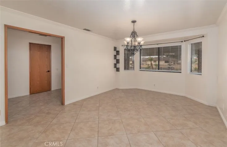 Large formal dining room with great front yard views!