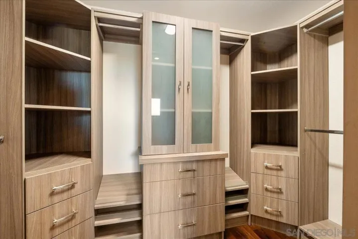 Primary bedroom walk-in closet