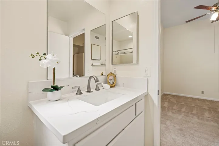 Modern fixtures and vanity , showcases very clean.