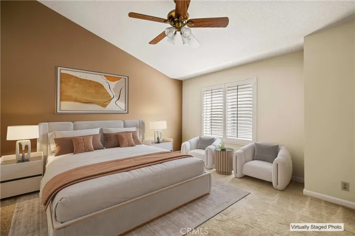 Primary Bedroom featuring a ceiling fan custom shutters.