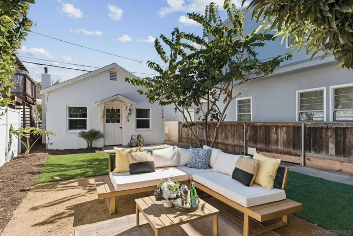 Step out through the brand new slider to a shady, private patio and artificial, easy care lawn.