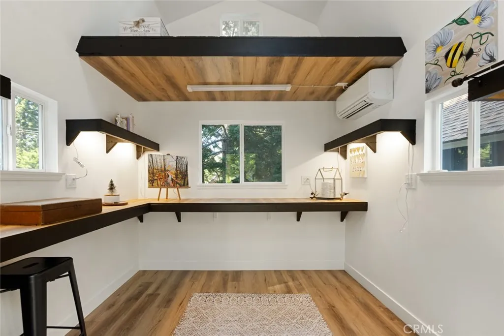 Detached finished bonus space equipped with mini-split is already ready to use as a your home office or creative workspace.