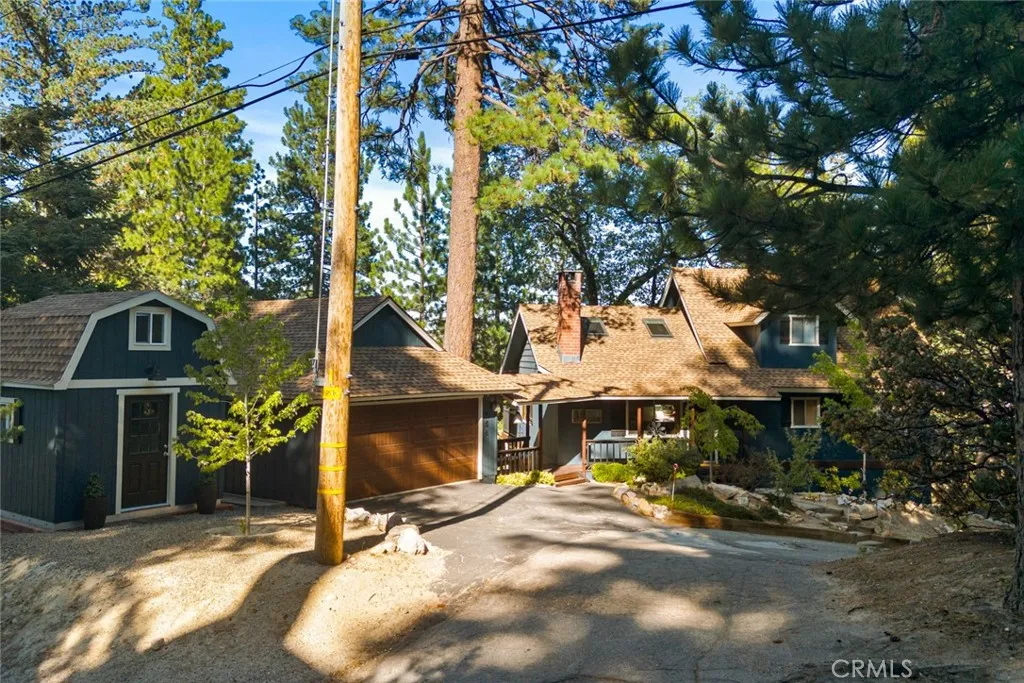 Easy access in all seasons at this corner home via two city-plowed main roads, and an access road!