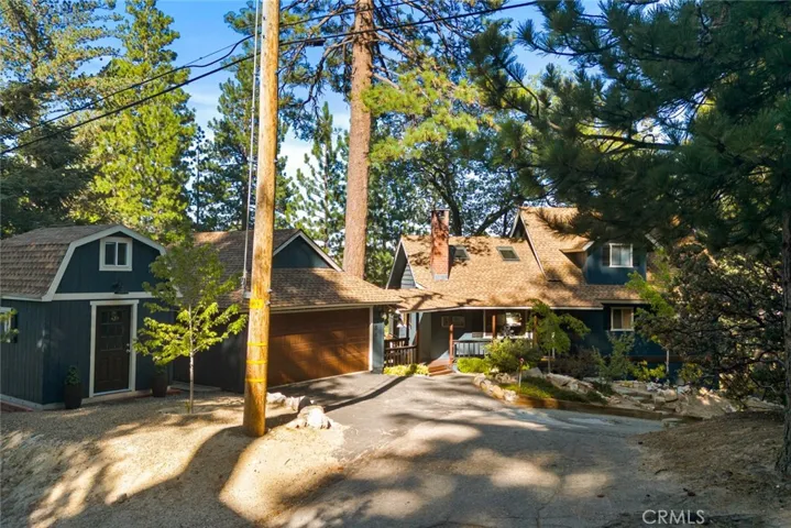 Easy access in all seasons at this corner home via two city-plowed main roads, and an access road!